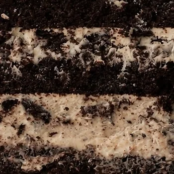 Oreo cake layers with chocolate sponge, cream and cookie crunch